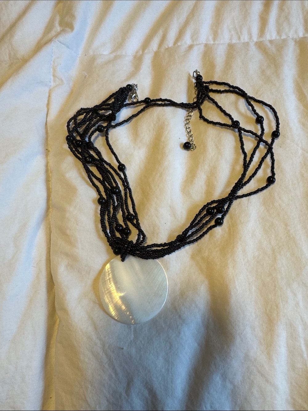 Black Beaded Multi-Strand Necklace with Mother-of-Pearl Pendant